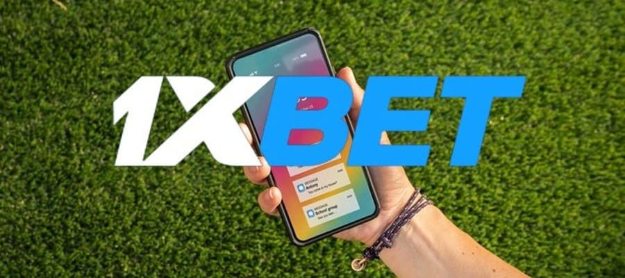 1xbet app with logo and mobile phone.